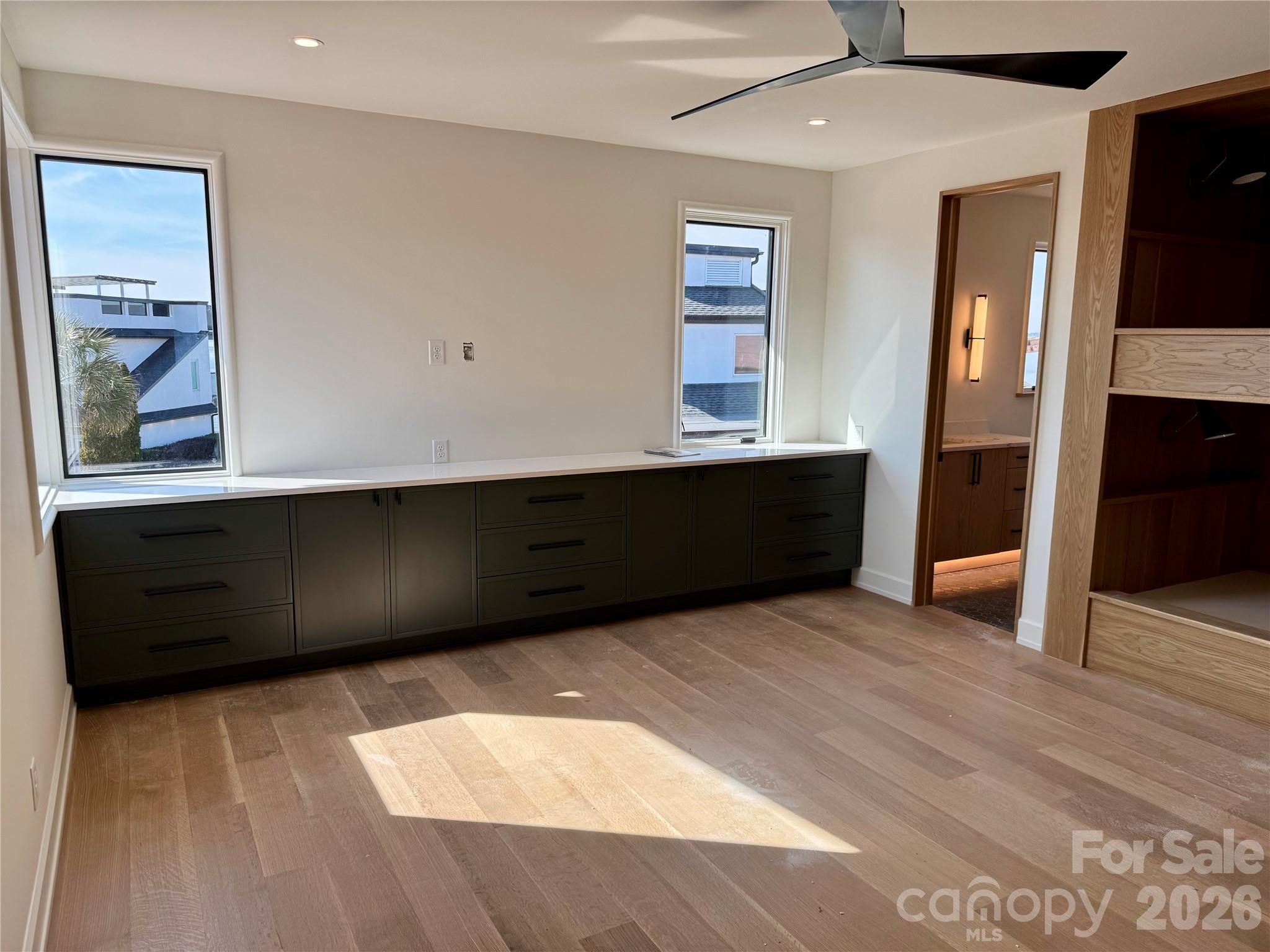22554 John Gamble Road Cornelius, NC 28031 - Photo 36 of 45 a view of an empty room with window and wooden floor