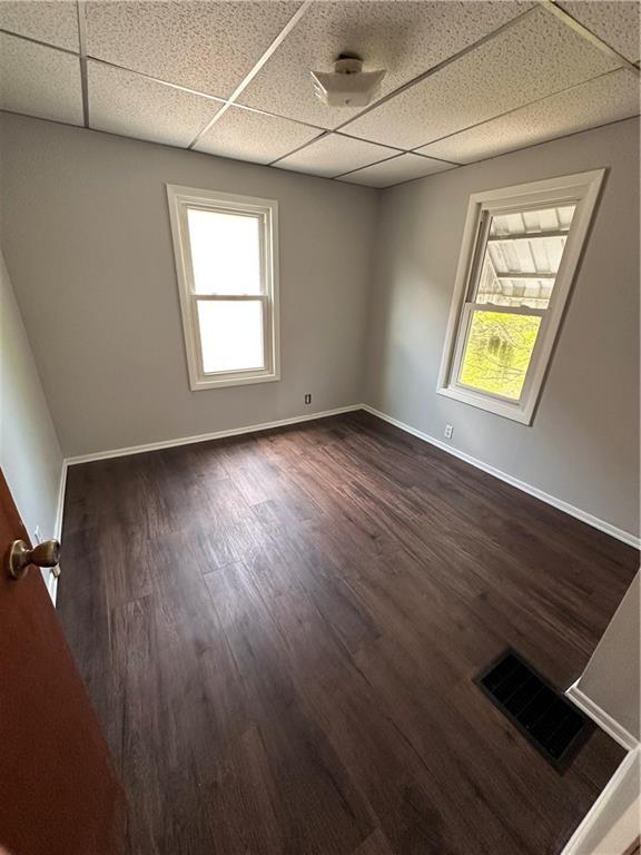 1418 Beckham Street Pittsburgh, PA 15212 - Photo 10 of 22 an empty room with wooden floor and windows