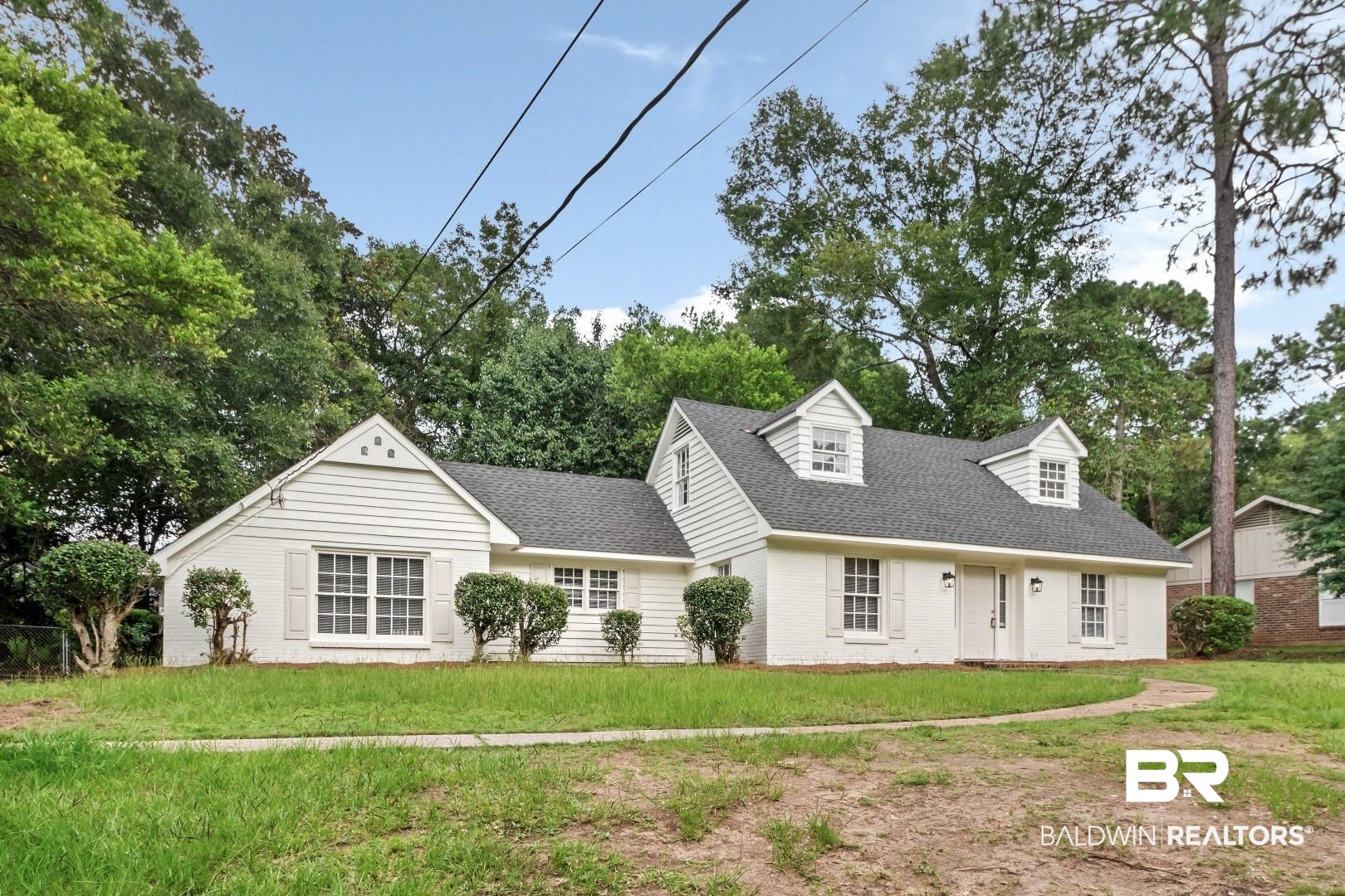 810 Nassau Drive Mobile, AL 36608 - Photo 27 of 31 Cape cod house featuring a front lawn, a shingled roof, and brick siding