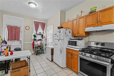 a kitchen with stainless steel appliances granite countertop a stove and a refrigerator