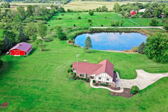 a view of a table and chairs with the garden