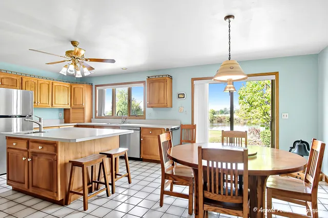 a view of a dining room with furniture window and outside view
