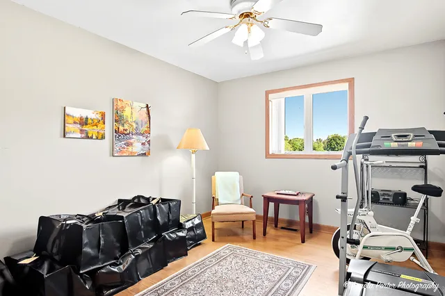 a bedroom with two beds and a large window