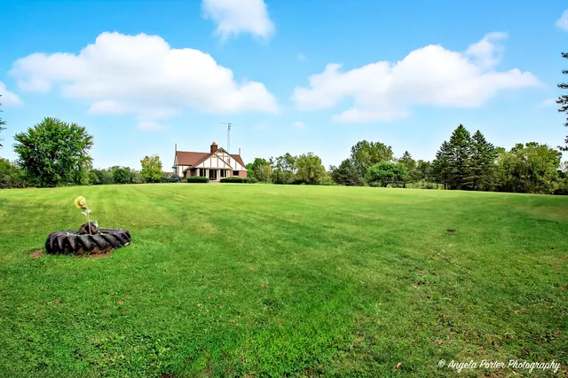 a view of a table and chairs in the garden