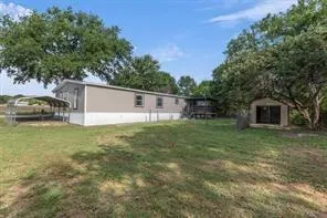 a backyard of a house with lots of green space