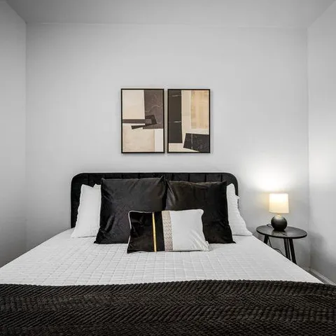 a bedroom with a bed and window