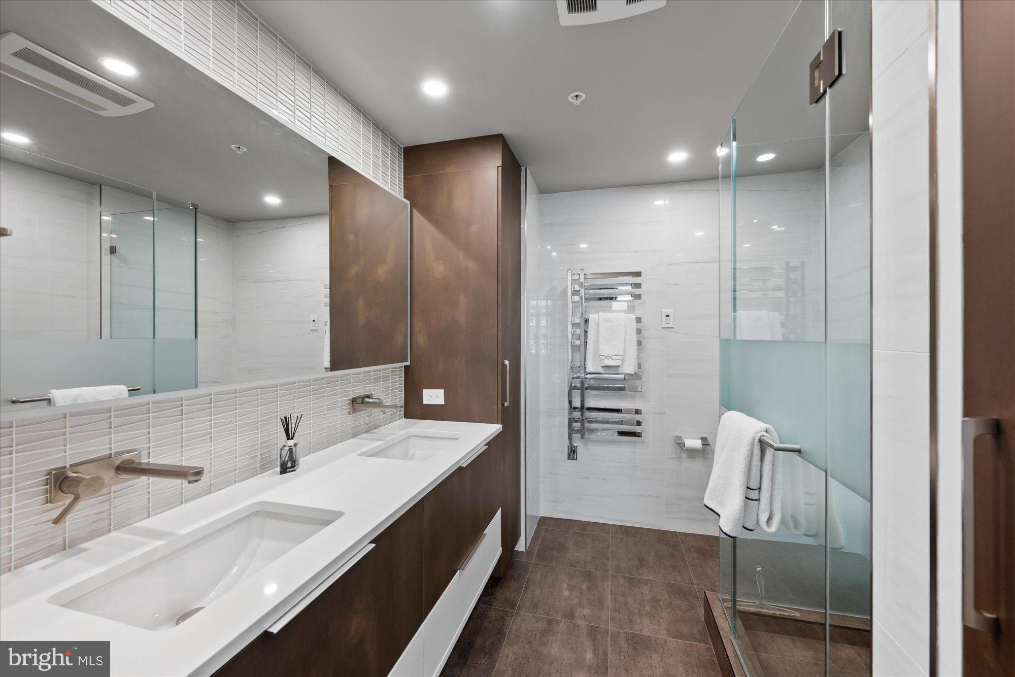 2225 California Street Northwest, Unit 402 Washington, DC 20008 - Photo 21 of 31 Primary bath with dual sink vanity, shower