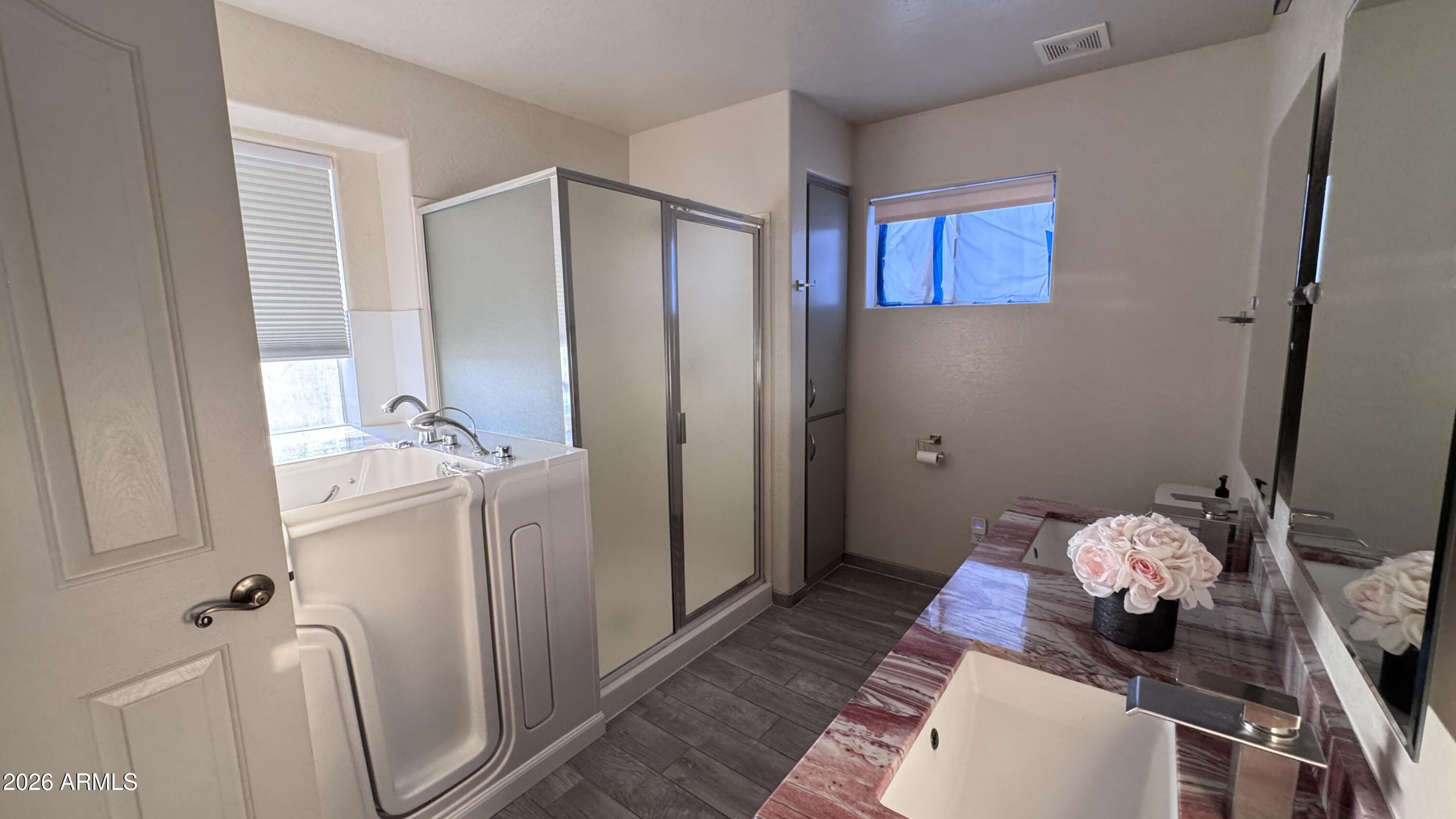 3640 North Prospectors Road Apache Junction, AZ 85119 - Photo 11 of 17 a bathroom with a sink mirror and toilet