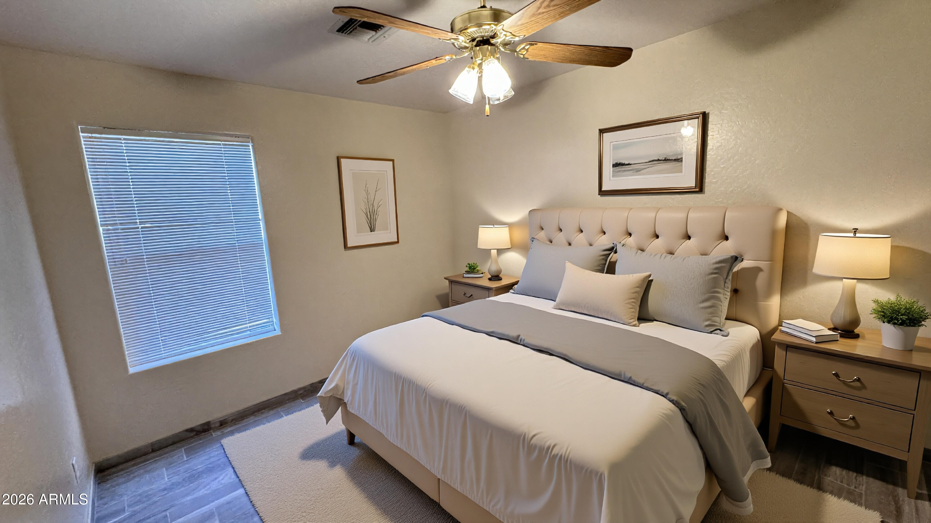 3640 North Prospectors Road Apache Junction, AZ 85119 - Photo 13 of 17 a bedroom with a bed and a lamp on dresser