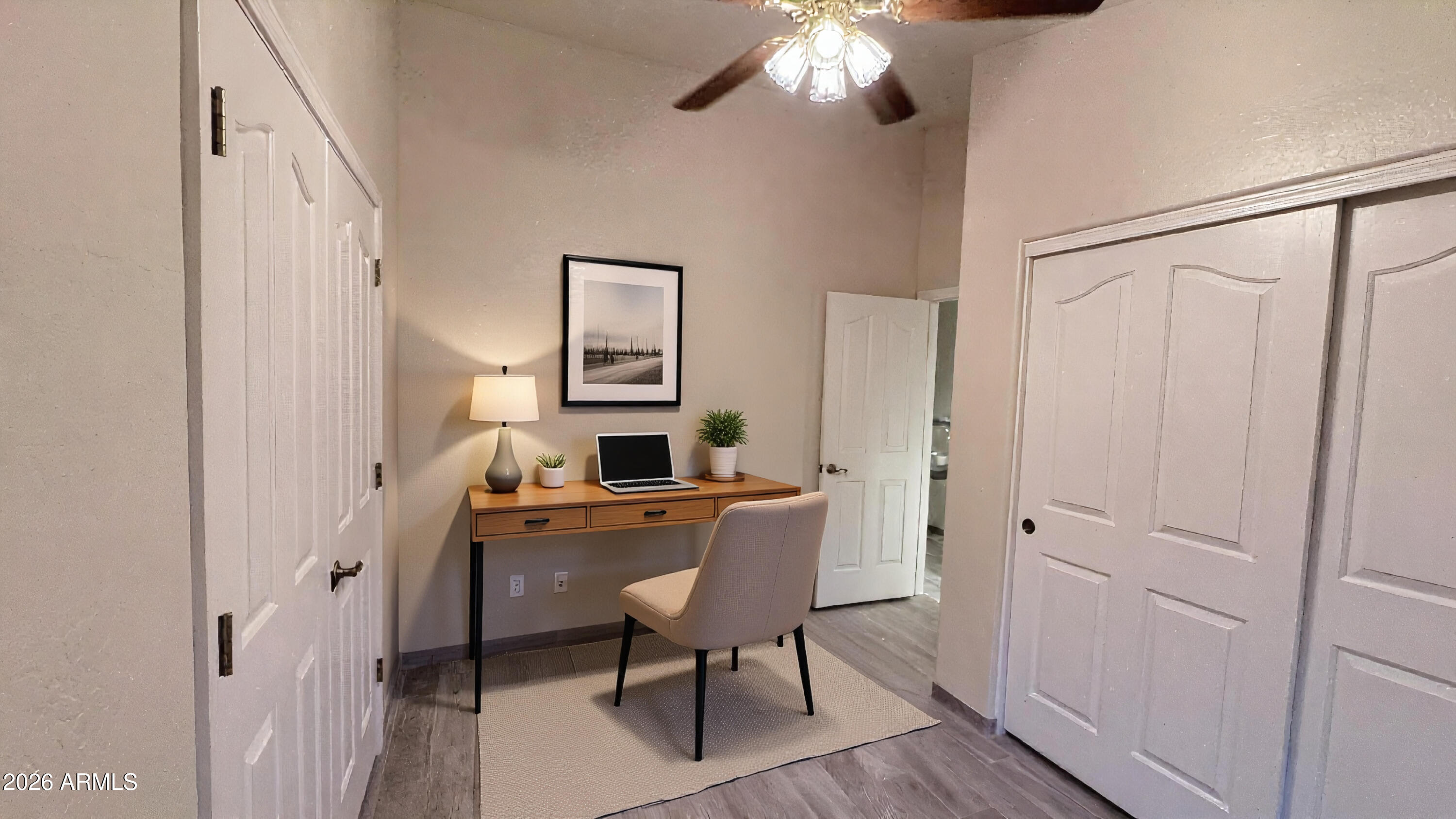 3640 North Prospectors Road Apache Junction, AZ 85119 - Photo 16 of 17 a workspace with furniture and wooden floor