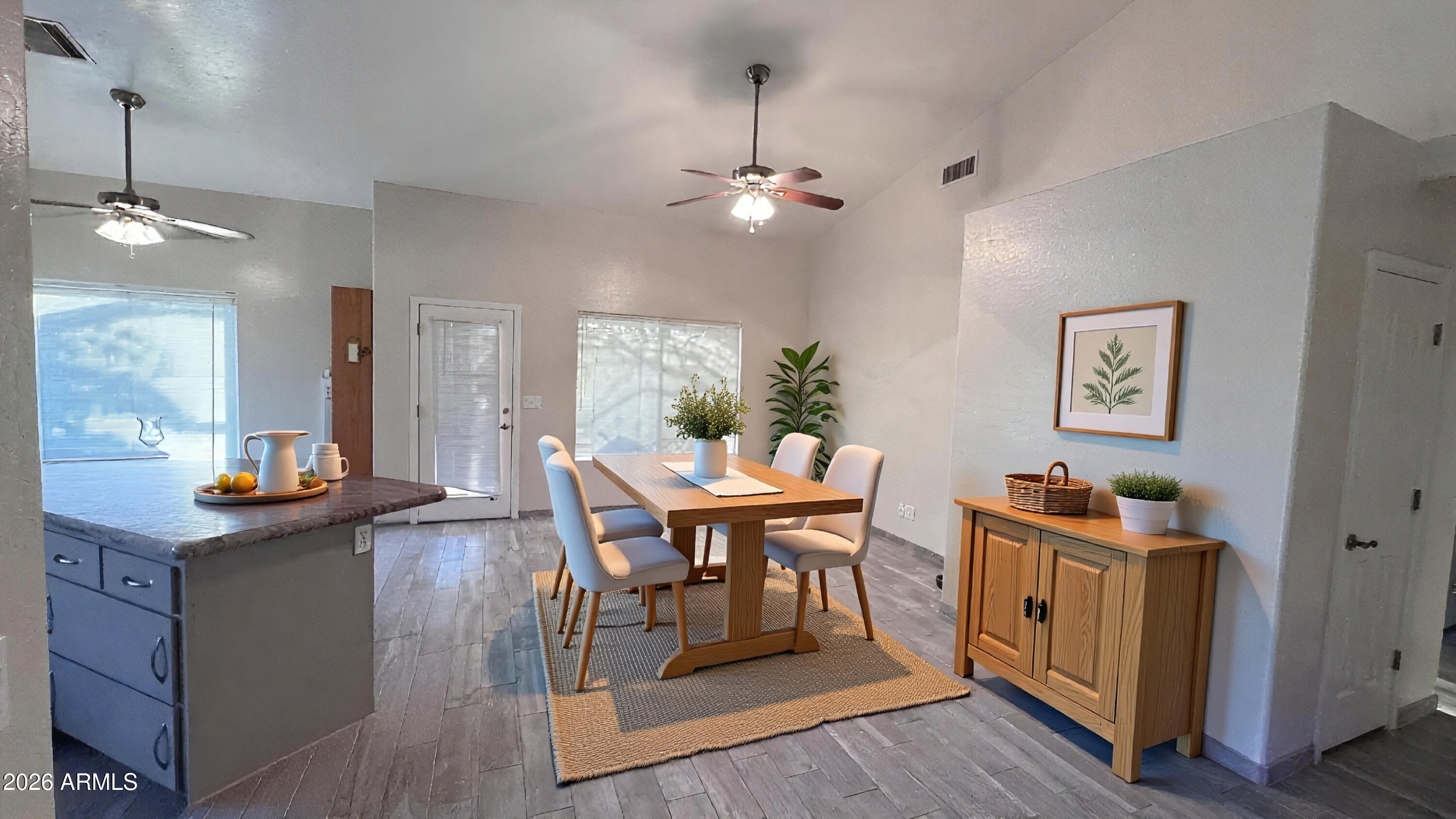 3640 North Prospectors Road Apache Junction, AZ 85119 - Photo 7 of 17 a view of a dining room with furniture and wooden floor