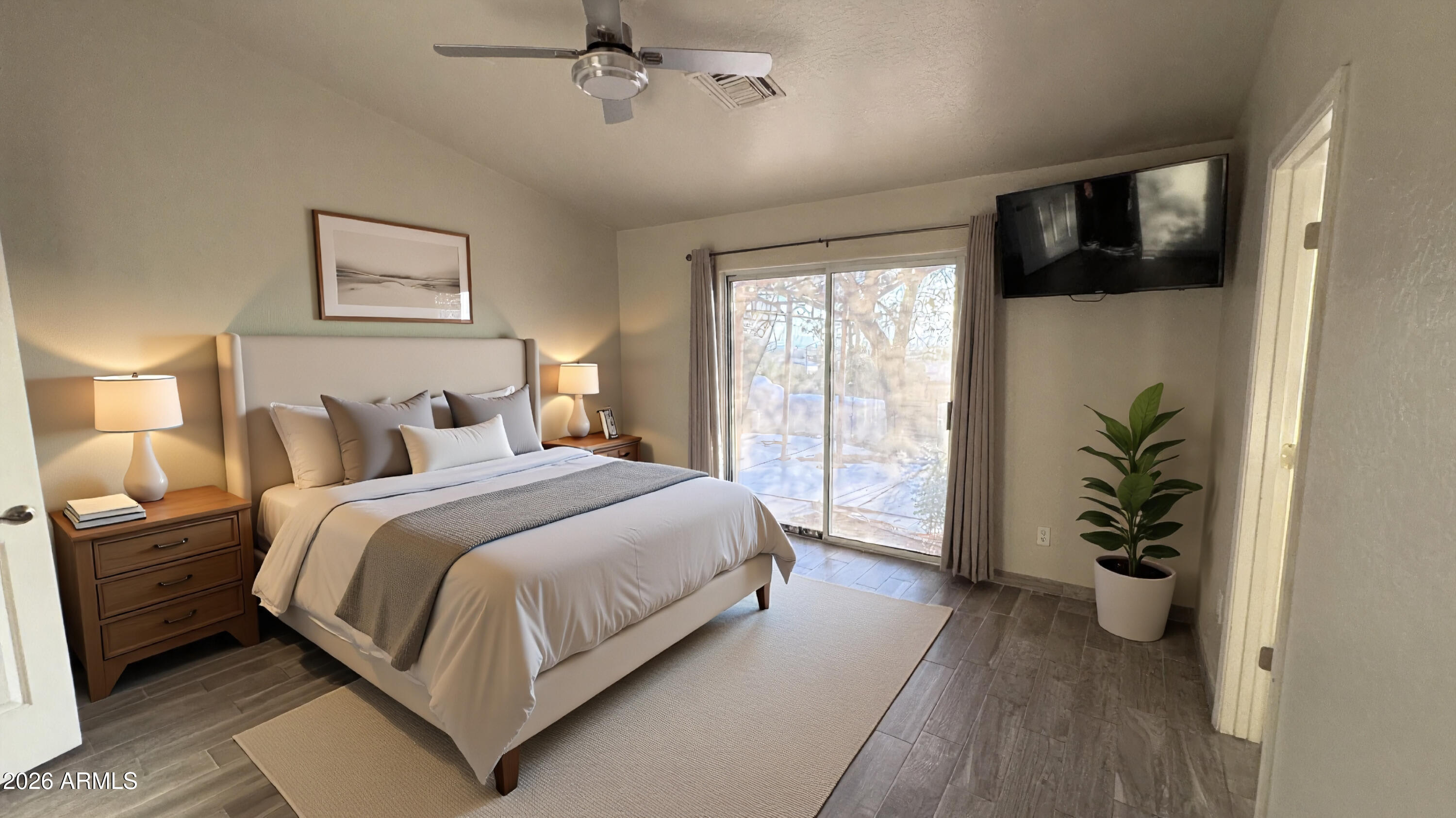 3640 North Prospectors Road Apache Junction, AZ 85119 - Photo 9 of 17 a bedroom with a large bed and a potted plant