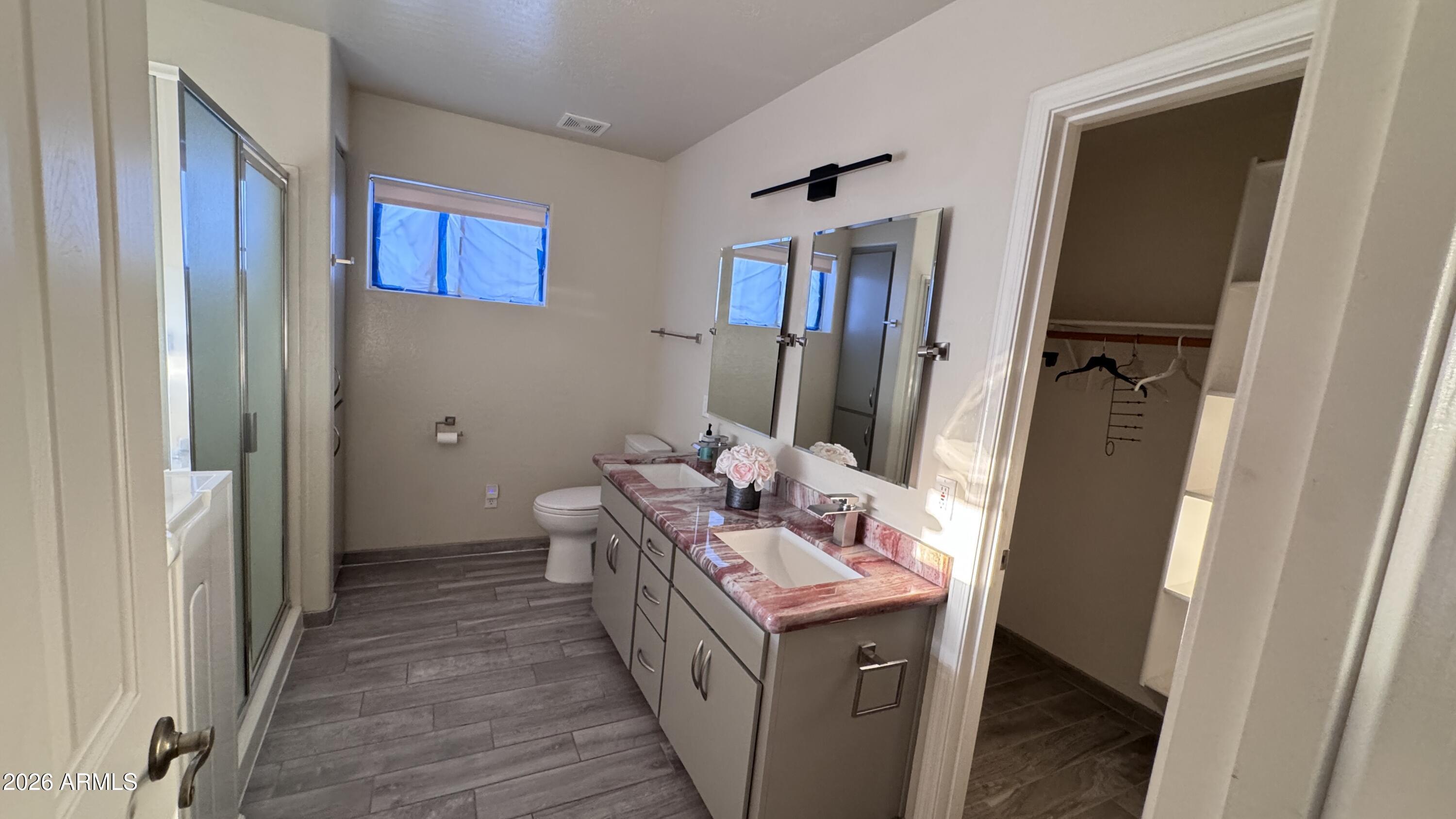 3640 North Prospectors Road Apache Junction, AZ 85119 - Photo 10 of 17 a bathroom with a sink a toilet and shower