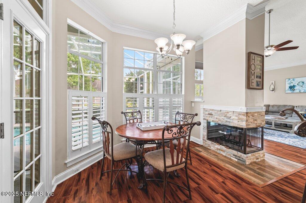 729 Cherry Grove Road Orange Park, FL 32073 - Photo 11 of 34 a view of a dining room with furniture window and wooden floor