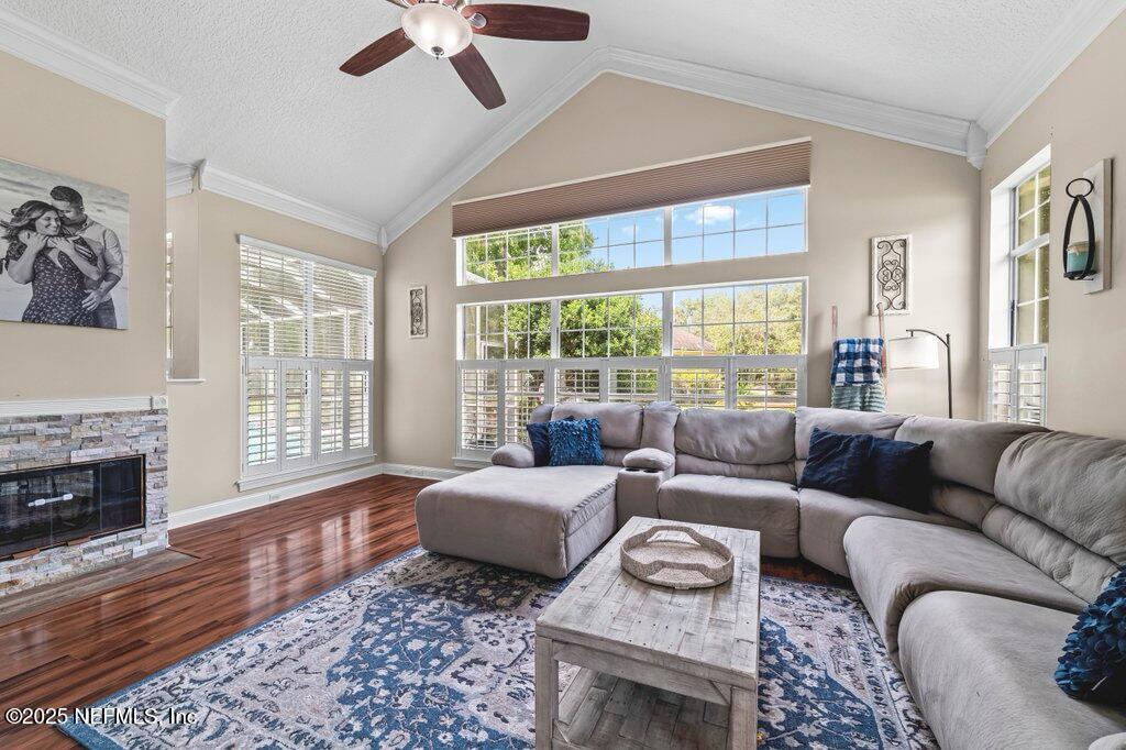 729 Cherry Grove Road Orange Park, FL 32073 - Photo 12 of 34 a living room with furniture and a fireplace