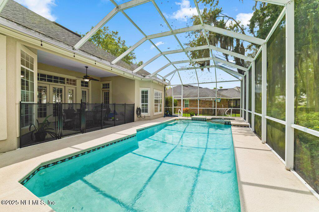 729 Cherry Grove Road Orange Park, FL 32073 - Photo 24 of 34 a view of a porch with a floor to ceiling window
