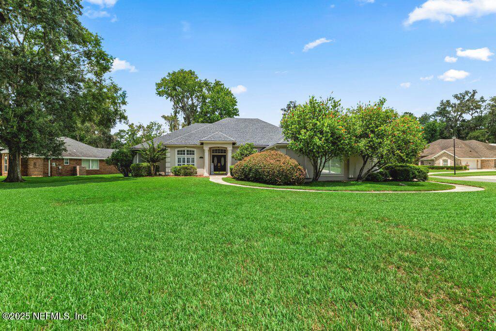 729 Cherry Grove Road Orange Park, FL 32073 - Photo 34 of 34 a house view with a garden space