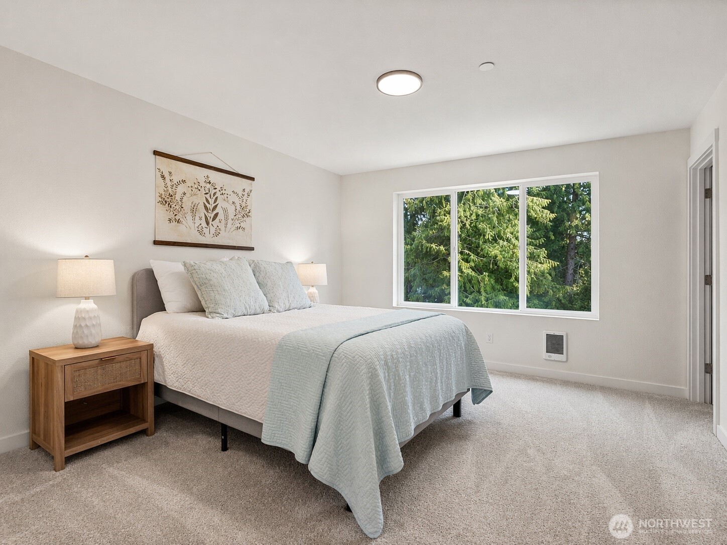 19505 Damson Road, Unit C2 Lynnwood, WA 98036 - Photo 6 of 13 a spacious bedroom with a bed and a large window