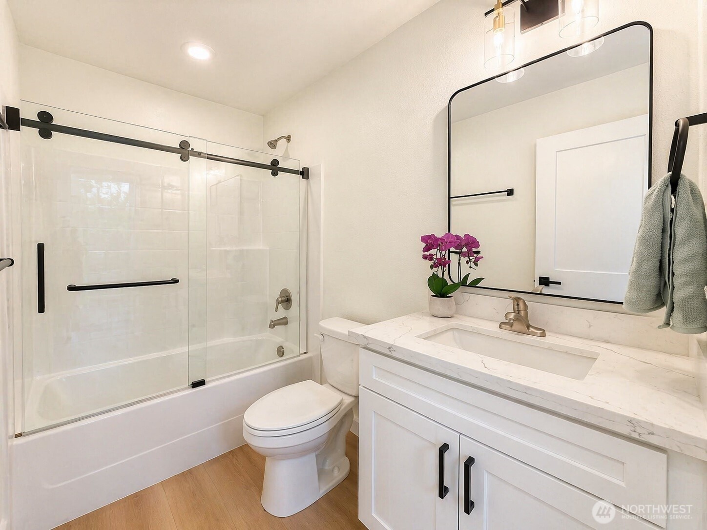 19505 Damson Road, Unit C2 Lynnwood, WA 98036 - Photo 7 of 13 a bathroom with a sink a toilet and shower