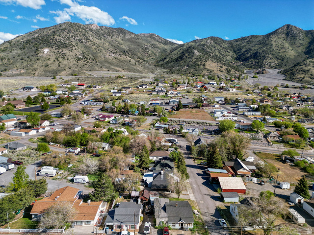 44 Shriver Street Eureka, UT 84628 - Photo 37 of 43 Aerial perspective showcasing a residential community nestled against a mountainous backdrop