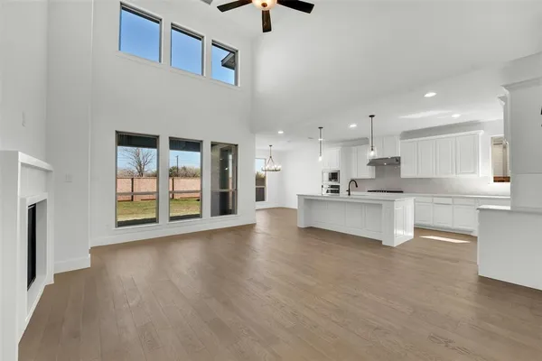 a view of kitchen with refrigerator and window