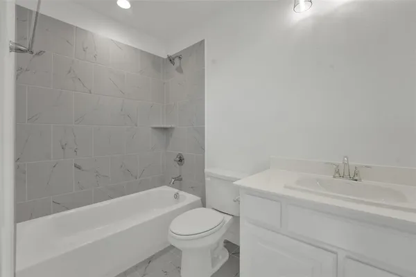 a bathroom with a sink toilet and bathtub