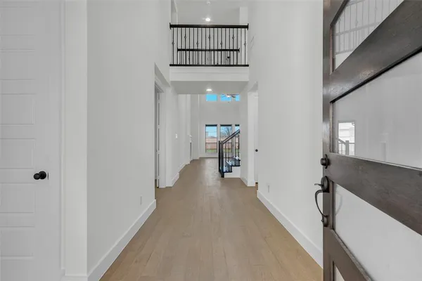 a view of a hallway view with staircase
