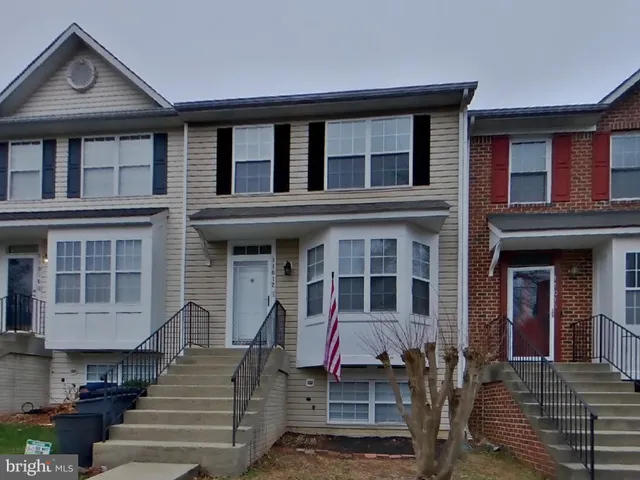 a front view of a house with a porch