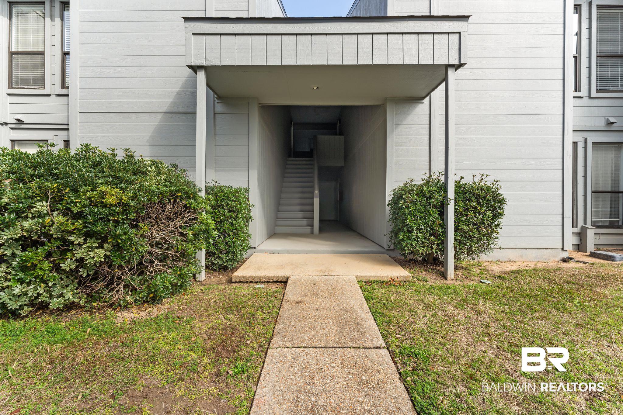 128 West Satsuma Avenue, Unit 128 Foley, AL 36535 - Photo 37 of 41 Entrance to property with a lawn