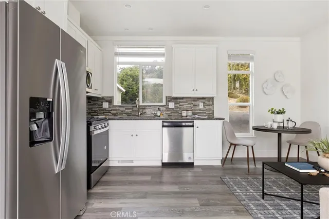 a view of a balcony with wooden floor