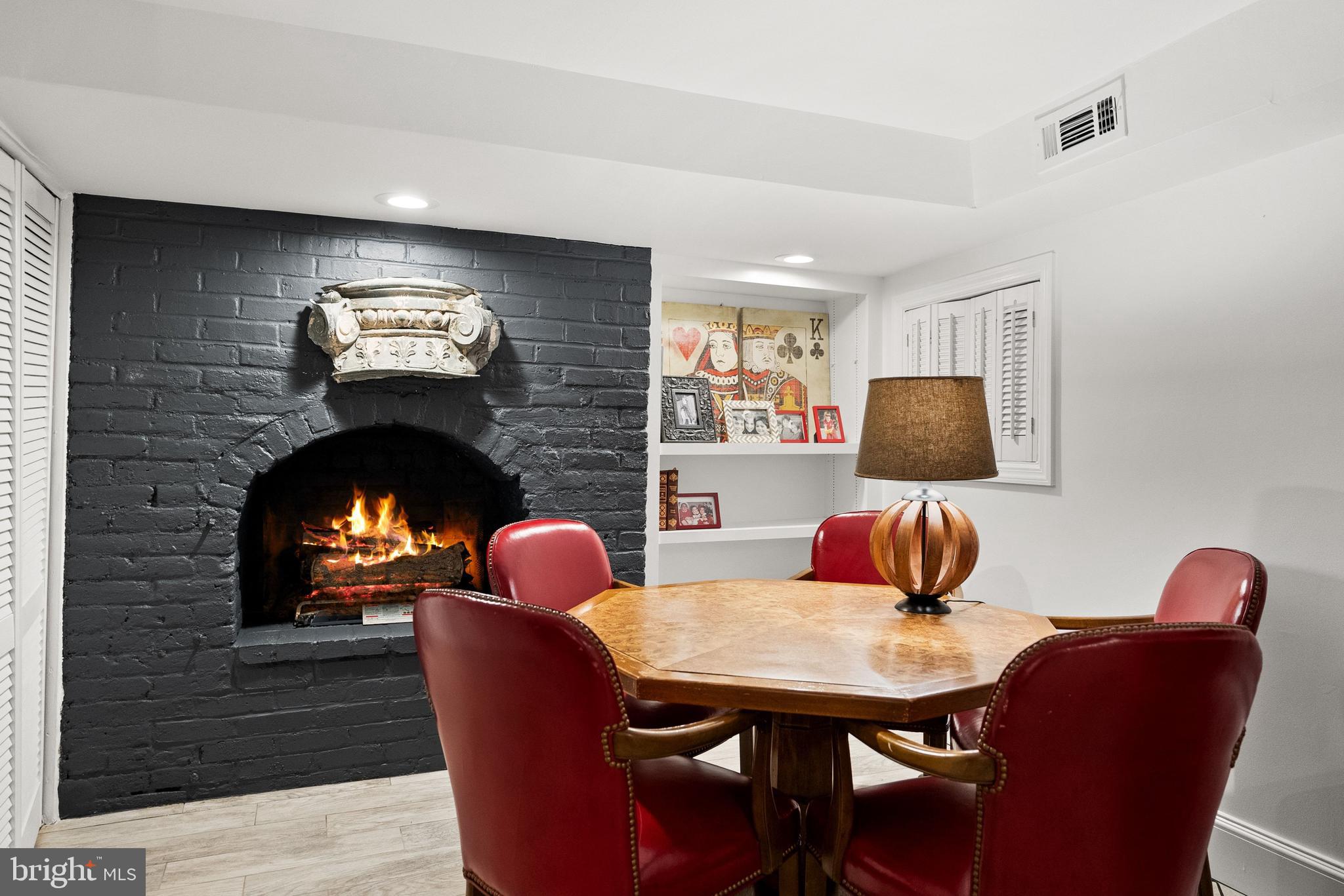 1412 28th Street Northwest Washington, DC 20007 - Photo 22 of 27 a living room with furniture a fireplace and a flat screen tv