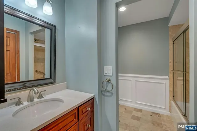 a bathroom with a sink and a mirror
