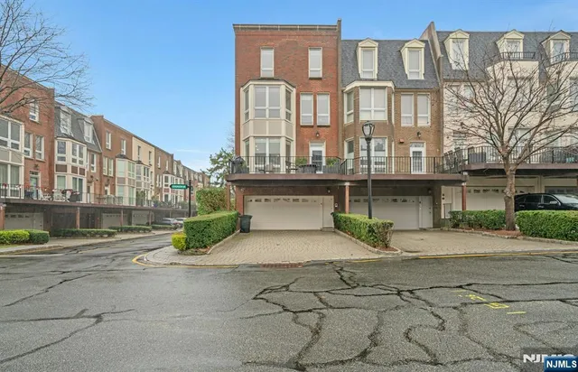 a view of a brick building next to a road