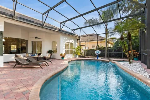 a view of a swimming pool with sitting area