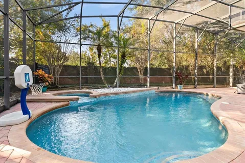 a view of a swimming pool with a patio