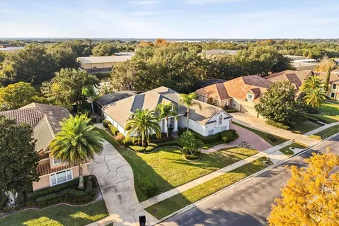an aerial view of residential houses with outdoor space