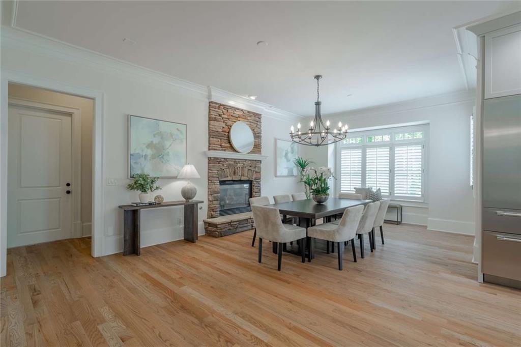 1364 Manget Way Dunwoody, GA 30338 - Photo 13 of 66 a view of a dining room with furniture window and wooden floor