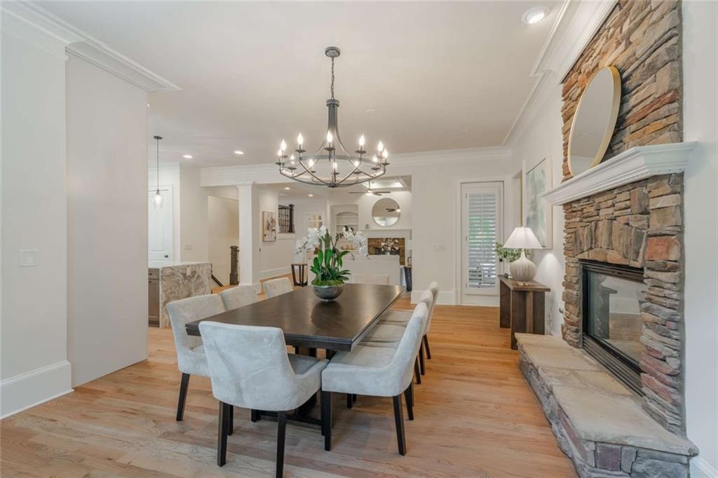 1364 Manget Way Dunwoody, GA 30338 - Photo 14 of 66 a view of a dining room with furniture and chandelier