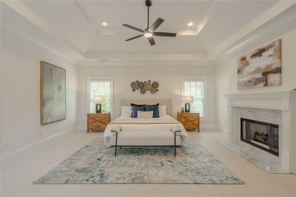 1364 Manget Way Dunwoody, GA 30338 - Photo 25 of 66 a bed room with a bed and a fireplace