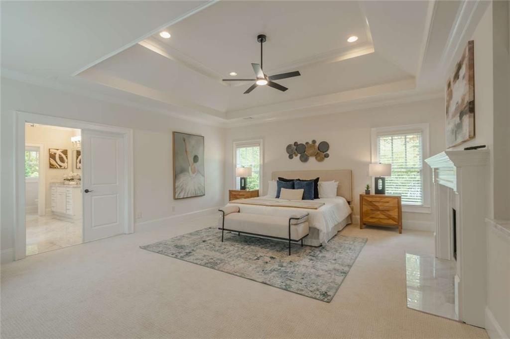1364 Manget Way Dunwoody, GA 30338 - Photo 26 of 66 a living room with furniture and a chandelier