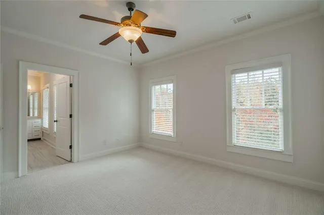 a living room with furniture a fireplace and a floor to ceiling window