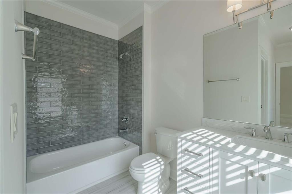 1364 Manget Way Dunwoody, GA 30338 - Photo 39 of 66 a bathroom with a bathtub and shower