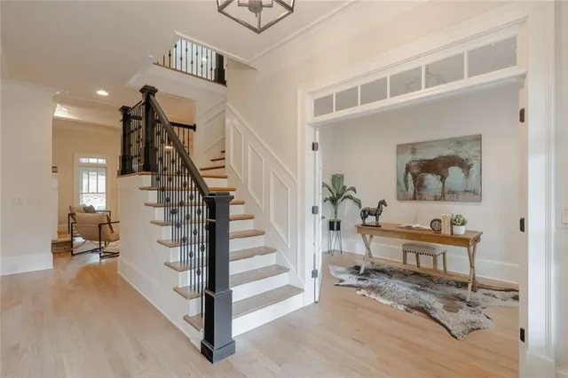 a living room with furniture a rug and white walls