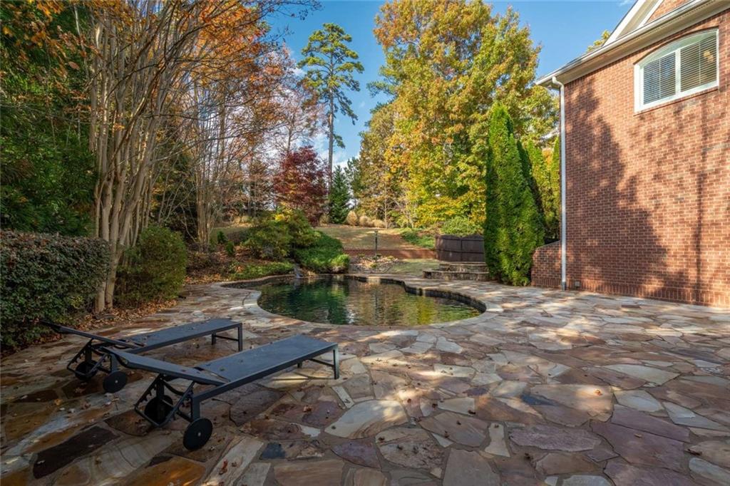 1364 Manget Way Dunwoody, GA 30338 - Photo 55 of 66 a view of a backyard with sitting area