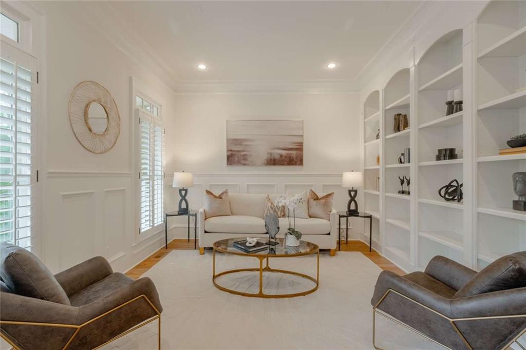 1364 Manget Way Dunwoody, GA 30338 - Photo 7 of 66 a living room with furniture a rug and white walls