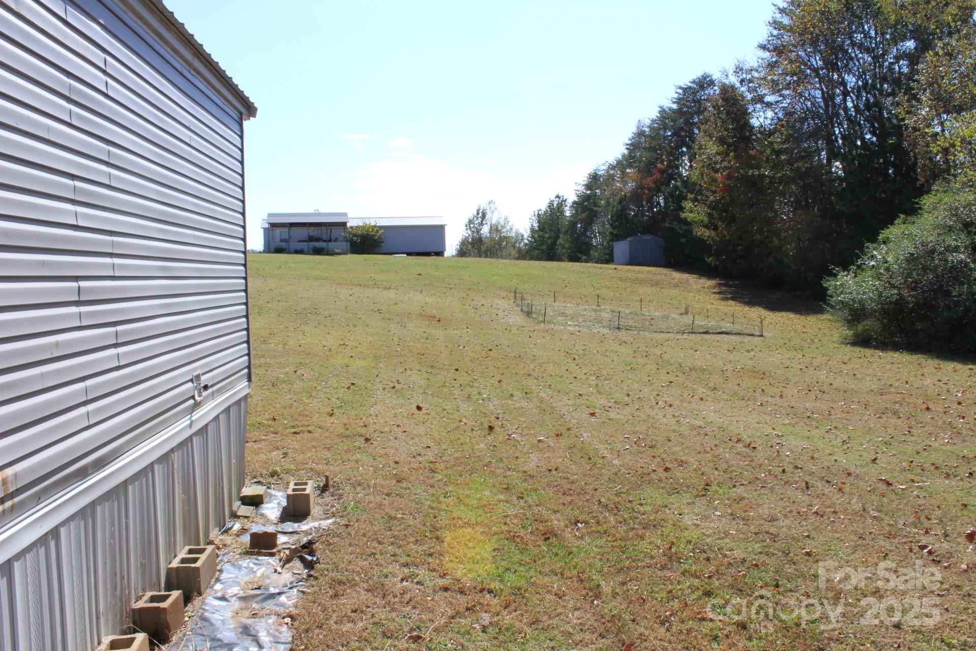 260 Buck Br Road Mill Spring, NC 28756 - Photo 30 of 32 a view of a backyard