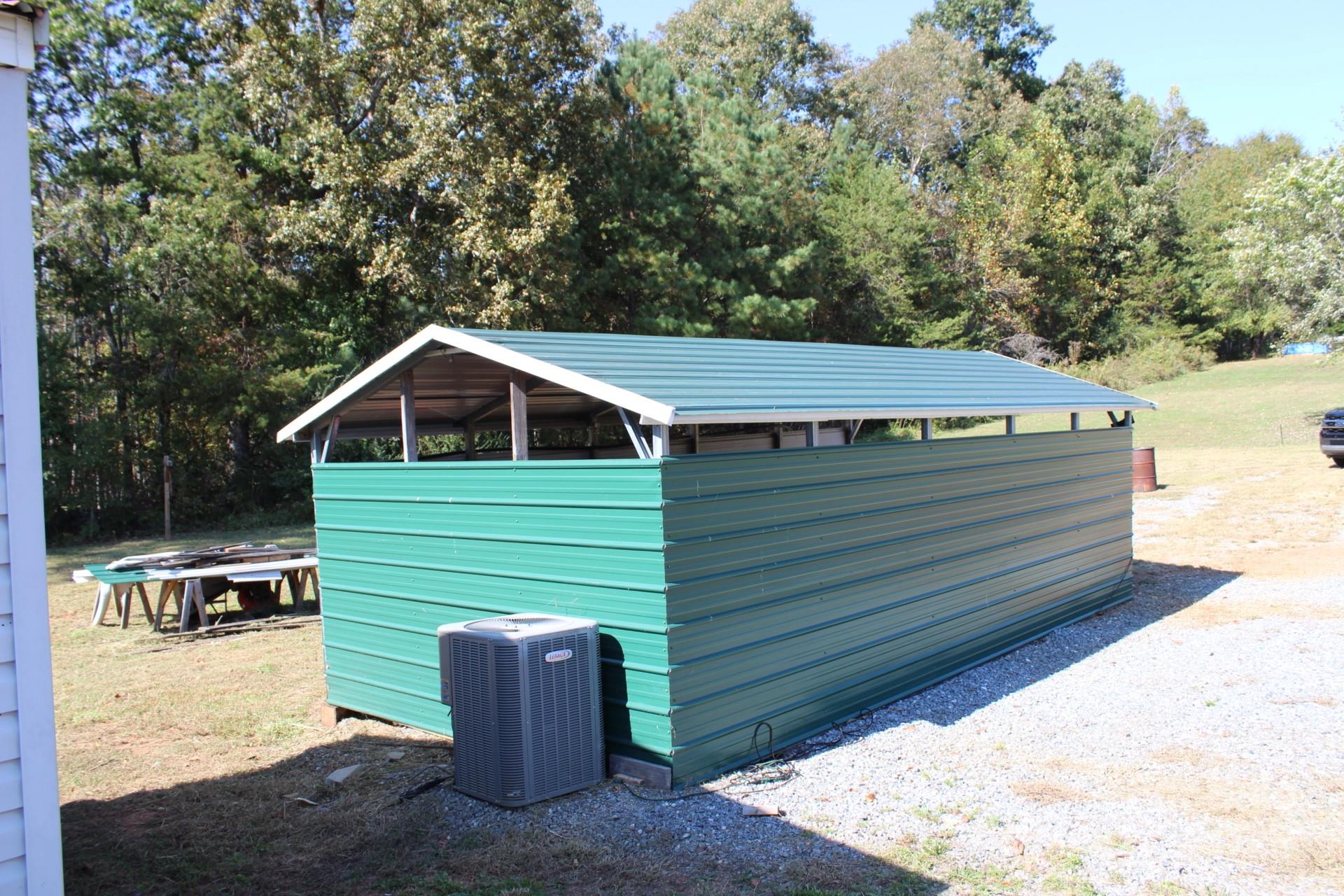260 Buck Br Road Mill Spring, NC 28756 - Photo 5 of 32 a view of house with backyard and seating area