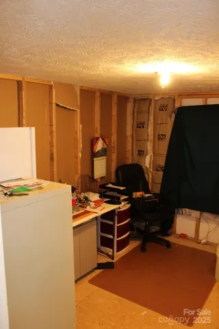 a workspace with furniture and screen