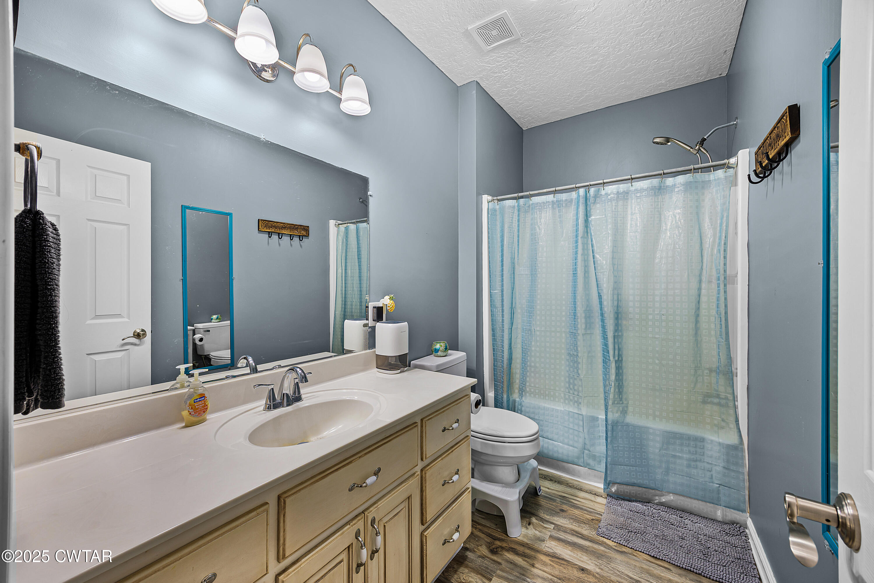 31 Turkey Creek Road Medina, TN 38355 - Photo 14 of 21 a bathroom with double vanity sink a toilet a shower and a mirror