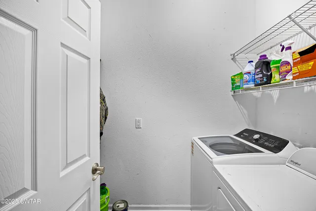 a spacious bedroom with a bed and a window